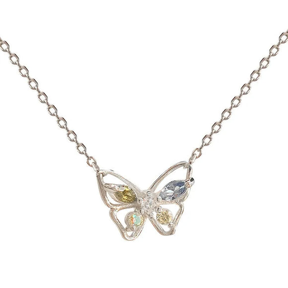 Butterfly-shaped necklace with gemstones on a white background